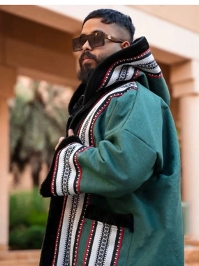 Olive-colored winter fur coat with an Arabic Sadu design