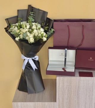 Bouquet with a pen for a man's day