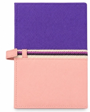 A handcrafted notebook folder decorated with hand-woven Sadu embroidery.