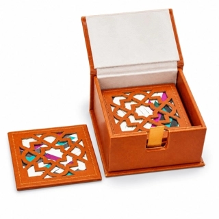 A luxurious coaster made from recycled leather and decorated with hand-woven wicker.