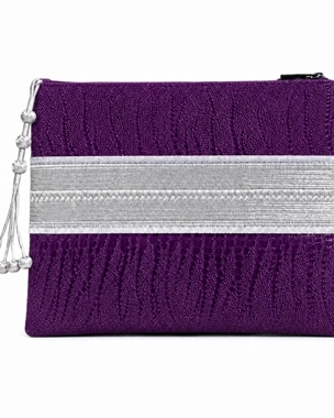 A luxurious bag made of purple leather and hand-crafted silver zari.