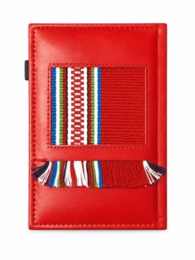 A notebook made from recycled leather, decorated with handmade Sadu weaving.