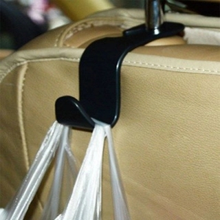 Bag hanger behind the car seat