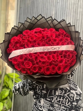 A large bouquet of red roses