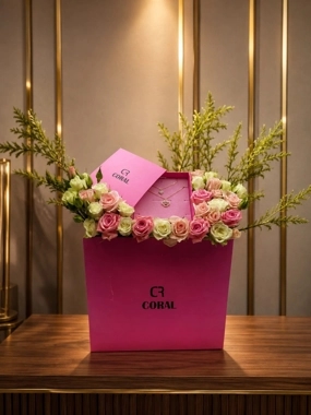 A bouquet of roses with a necklace