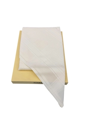 A sugar-colored (beige-tinged) shemagh