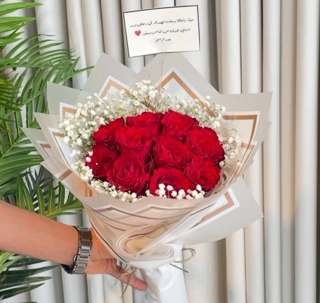 A bouquet of red roses from me