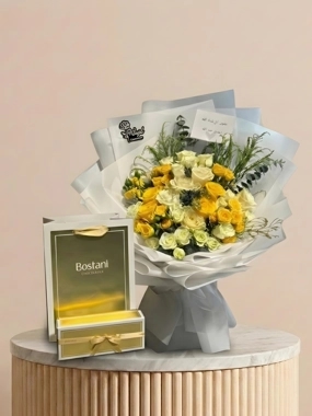 A bouquet of roses with garden chocolates