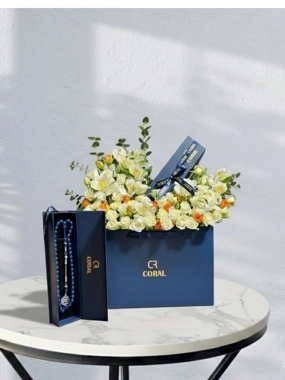 Rosary with a rose arrangement