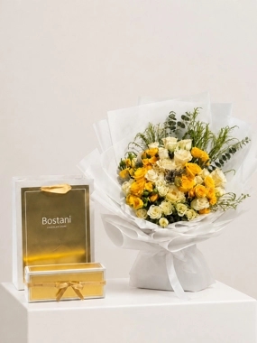 A bouquet of roses with garden chocolates