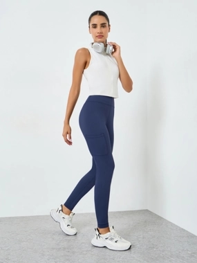 Styli Active Women Knee Rubber Logo Side Pocket Leggings