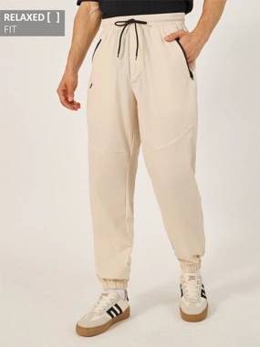 Styli Solid Relaxed Fit Elasticated Cuff Joggers with Contrast Zip detail