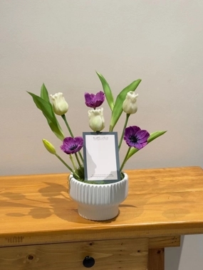 Purple and white artificial rose vase