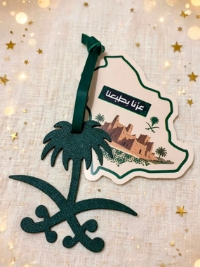 A leather pendant of two swords and a palm tree